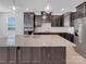 Modern kitchen with a large center island, granite countertops, and stainless steel appliances at 14106 Ridgewater Way, Charlotte, NC 28278