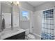 Bathroom featuring tile flooring, a shower and tub combo, and a sleek single sink vanity at 1522 Peridoe Point Ln, Charlotte, NC 28206