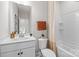 Clean, well-lit bathroom featuring a tub-shower combination, single vanity, and neutral color palette at 15340 Ballancroft Pkwy # 15, Charlotte, NC 28277