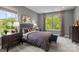 Comfortable bedroom with natural light, a plush bed, and matching nightstands and dressers at 15340 Ballancroft Pkwy # 15, Charlotte, NC 28277