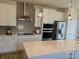 Modern kitchen featuring white cabinets, stainless steel appliances, and island at 15340 Ballancroft Pkwy # 15, Charlotte, NC 28277