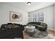 Cozy game room features modern decor, a comfortable sofa, and a foosball table at 2006 Mantle Ridge Dr, Indian Trail, NC 28079