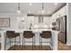 Well-equipped kitchen island featuring pendant lighting, seating, and modern appliances at 2006 Mantle Ridge Dr, Indian Trail, NC 28079