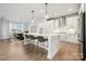 Bright kitchen features a large island, stainless steel appliances, and modern lighting at 2006 Mantle Ridge Dr, Indian Trail, NC 28079