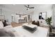 Open-concept living area with hardwood flooring and seamless transition to the modern kitchen at 2006 Mantle Ridge Dr, Indian Trail, NC 28079