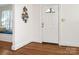 Light-filled foyer with hardwood floors, decorative accents, and a window seat, creating a warm welcome at 2028 Scott Ave, Charlotte, NC 28203