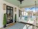 Inviting front porch with a swing, stylish decor, and a 'Welcome' mat, perfect for relaxing outdoors at 2028 Scott Ave, Charlotte, NC 28203