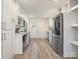 Modern kitchen with stainless steel appliances, sleek cabinetry, and ample counter space for cooking and entertaining at 2028 Scott Ave, Charlotte, NC 28203