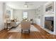 Bright living room featuring a fireplace, built-in shelving, and neutral-toned furniture for comfortable living at 2028 Scott Ave, Charlotte, NC 28203