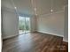 Bright bedroom featuring recessed lighting and large sliding glass door to balcony at 2035 Clarksdale Dr # 33, Charlotte, NC 28206