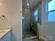 Close-up of the tiled walk-in shower with glass door at 2035 Clarksdale Dr # 33, Charlotte, NC 28206