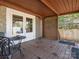 Relaxing back porch with outdoor seating, wood flooring and privacy lattice at 2112 Floral Ave, Charlotte, NC 28203