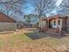 Large backyard with detached structure, rear porch and green spaces at 2112 Floral Ave, Charlotte, NC 28203