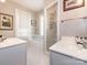 Bright bathroom with double sinks, a bathtub, and a separate shower at 2112 Floral Ave, Charlotte, NC 28203
