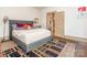 Comfortable bedroom with a plush bed, decorative rug, and walk-in closet at 2112 Floral Ave, Charlotte, NC 28203