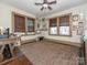 Versatile bedroom with a ceiling fan, natural light, and hardwood floors at 2112 Floral Ave, Charlotte, NC 28203