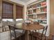 Cozy breakfast nook with built-in seating, wooden table and lots of natural light at 2112 Floral Ave, Charlotte, NC 28203