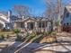 Charming bungalow-style home with craftsman details and mature trees on a sunny day at 2112 Floral Ave, Charlotte, NC 28203