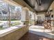 Spacious front porch featuring brick floors and detailed pillar at 2112 Floral Ave, Charlotte, NC 28203