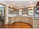 Stylish kitchen with custom shelving, granite countertops, and stainless steel appliances at 2112 Floral Ave, Charlotte, NC 28203