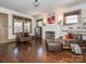 Cozy living room featuring hardwood floors, fireplace, and natural light at 2112 Floral Ave, Charlotte, NC 28203