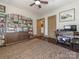 Inviting living room features hardwood floors and versatile layout with bookshelves at 2112 Floral Ave, Charlotte, NC 28203