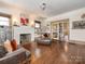 Spacious living room with fireplace, hardwood floors, and unique artistic features at 2112 Floral Ave, Charlotte, NC 28203