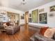 Open living room featuring hardwood floors, textured walls, and eclectic art collection at 2112 Floral Ave, Charlotte, NC 28203