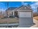 Charming one-story home with well-maintained landscaping, a two car garage, and lovely curb appeal at 2324 Lanza Dr, Charlotte, NC 28215
