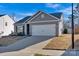 Charming one-story home with well-maintained landscaping, and a two car garage at 2324 Lanza Dr, Charlotte, NC 28215