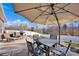 Outdoor patio dining area with an umbrella, lounge seating, and a grill at 2324 Lanza Dr, Charlotte, NC 28215