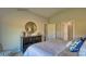 A calming bedroom with a large dresser and doorways to a bathroom and closet at 233 Giant Oak Ave, Statesville, NC 28677