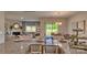 Open-concept kitchen and dining area with granite countertops and stainless steel sink at 233 Giant Oak Ave, Statesville, NC 28677