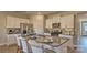 Bright kitchen with white cabinets, granite countertops, and an inviting island with seating at 233 Giant Oak Ave, Statesville, NC 28677