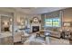 Comfortable living room with a cozy fireplace, neutral color palette, and ample natural light at 233 Giant Oak Ave, Statesville, NC 28677