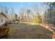 Wide view of backyard featuring large gazebo, open grassy area and a treed perimeter at 2864 Sweeping Pine Ln, Denver, NC 28037