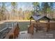 View from wooden deck of backyard featuring large gazebo and treed perimeter at 2864 Sweeping Pine Ln, Denver, NC 28037