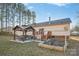 Relaxing backyard featuring a wooden deck, gazebo, and garden, perfect for outdoor living at 2864 Sweeping Pine Ln, Denver, NC 28037