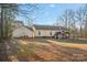 Wide view of backyard featuring home, large gazebo, open grassy area and a treed perimeter at 2864 Sweeping Pine Ln, Denver, NC 28037