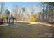 Wide view of backyard featuring large gazebo, open grassy area and a treed perimeter at 2864 Sweeping Pine Ln, Denver, NC 28037
