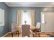 Cozy dining area with hardwood floors, neutral paint, and natural light at 2864 Sweeping Pine Ln, Denver, NC 28037