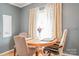 Cozy dining area with hardwood floors, neutral paint, and natural light at 2864 Sweeping Pine Ln, Denver, NC 28037