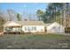Charming single-story home with a welcoming front porch and a detached two-car garage at 2864 Sweeping Pine Ln, Denver, NC 28037