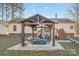 Backyard gazebo with seating, a table, and lush greenery, perfect for outdoor entertaining at 2864 Sweeping Pine Ln, Denver, NC 28037