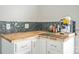Kitchenette with white cabinetry, subway tile backsplash, laminate countertops, and coffee machine at 2864 Sweeping Pine Ln, Denver, NC 28037