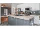 Modern kitchen features stainless steel appliances and a central island with a sink at 2864 Sweeping Pine Ln, Denver, NC 28037