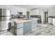 Modern kitchen features stainless steel appliances and a central island with a sink at 2864 Sweeping Pine Ln, Denver, NC 28037