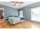 Main Bedroom with wooden floors, neutral walls, ceiling fan, and windows for natural light at 2864 Sweeping Pine Ln, Denver, NC 28037