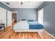 Main Bedroom with wooden floors, neutral walls, ceiling fan, and large windows for natural light at 2864 Sweeping Pine Ln, Denver, NC 28037