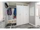 Mudroom featuring gray floors, white storage cabinets, and hall tree at 2864 Sweeping Pine Ln, Denver, NC 28037